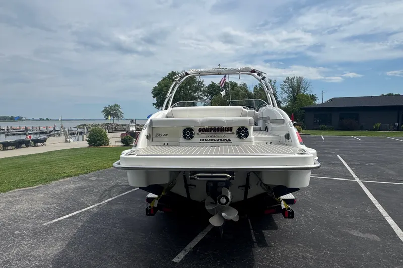 Slide: The Image of 2018 Formula 270 Bowrider boat parked near a scenic waterfront. - 7
