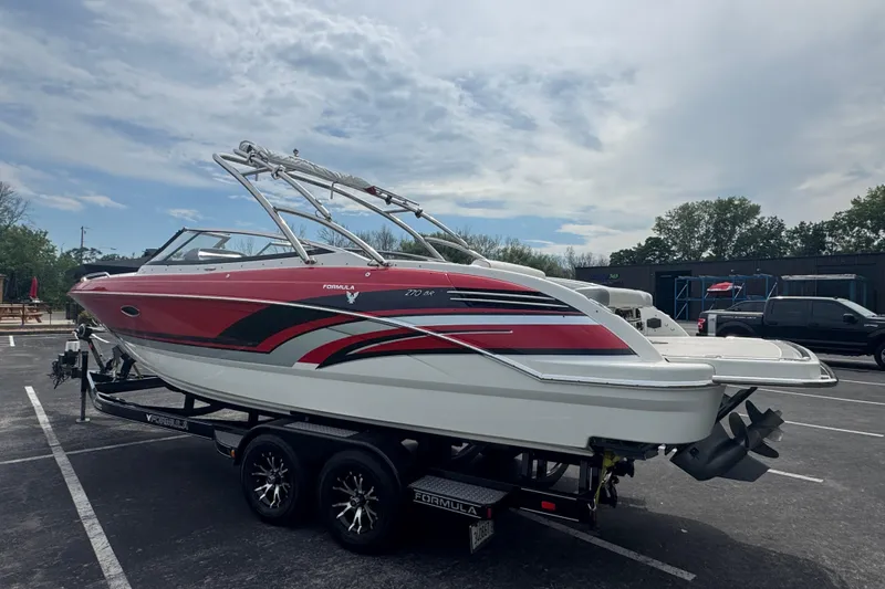 Slide: The Image of 2018 Formula 270 Bowrider boat on trailer in parking lot. - 4