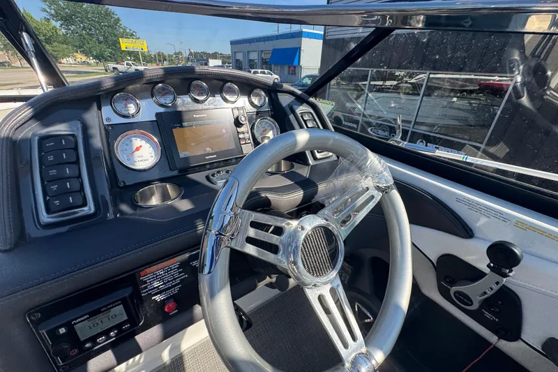 Slide: The Image of 2018 Formula 270 Bowrider dashboard with steering wheel and navigation controls. - 22