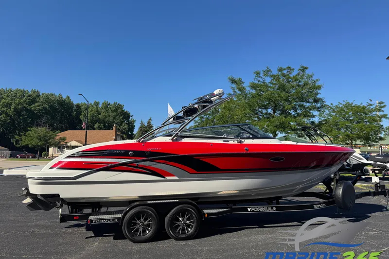 The Image of 2018 Formula 270 Bowrider boat with red and black accents on a trailer. - 0