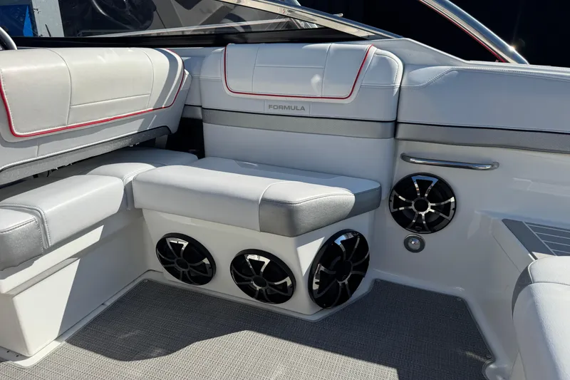 Slide: The Image of Interior of 2018 Formula 270 Bowrider boat with cushioned seating and built-in speakers. - 9