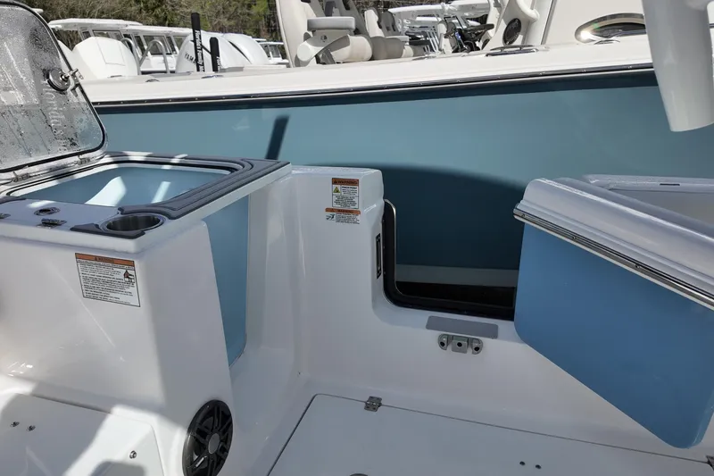 Slide: The Image of 2026 Sea Fox 268 Commander boat interior with storage compartments and seating area. - 13