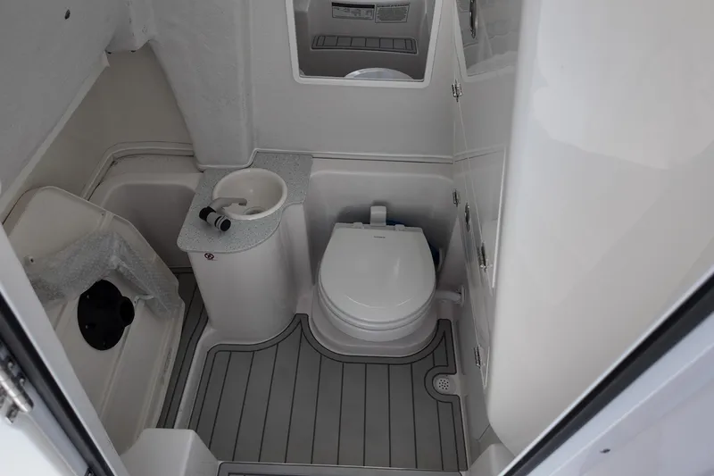 Slide: The Image of 2026 Sea Fox 268 Commander boat bathroom with toilet and sink. - 10