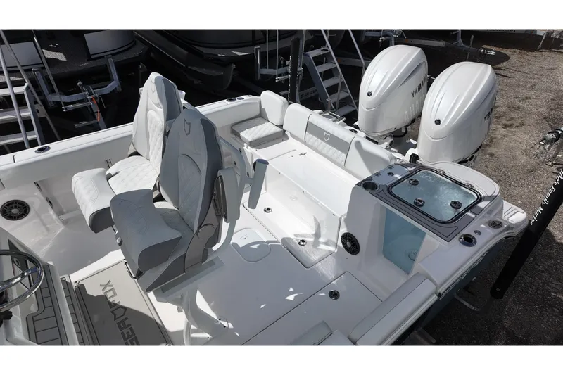 Slide: The Image of 2026 Sea Fox 268 Commander boat interior with dual seats and twin outboard engines. - 11