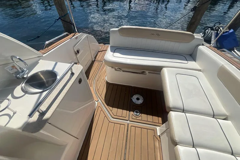 Slide: The Image of Luxurious 2010 Sea Ray Sundancer 260 boat interior with seating and sink. - 15