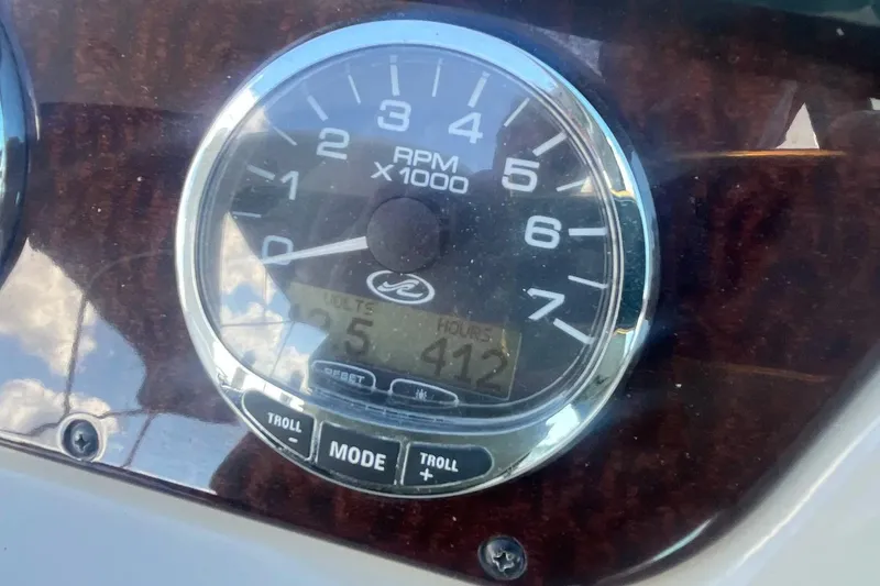 Slide: The Image of Close-up of 2010 Sea Ray Sundancer 260 RPM gauge showing 412 hours. - 23