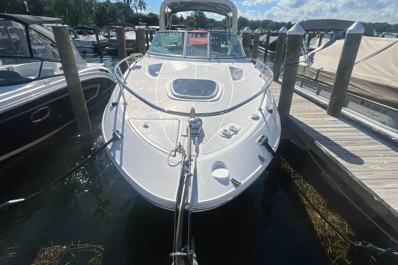Slide: The Image of 2010 Sea Ray Sundancer 260 docked at marina, sunny day, clear sky. - 5