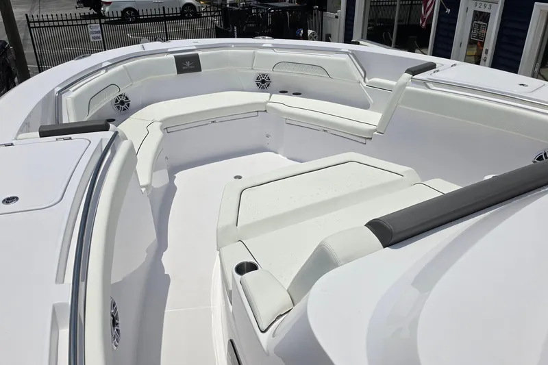 Slide: The Image of 2027 Bertram 39 CC boat interior with white seating and modern design. - 18