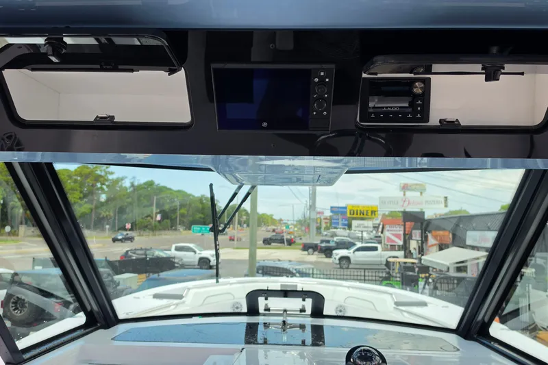 Slide: The Image of Interior view of 2027 Bertram 39 CC boat dashboard with navigation and audio systems. - 10