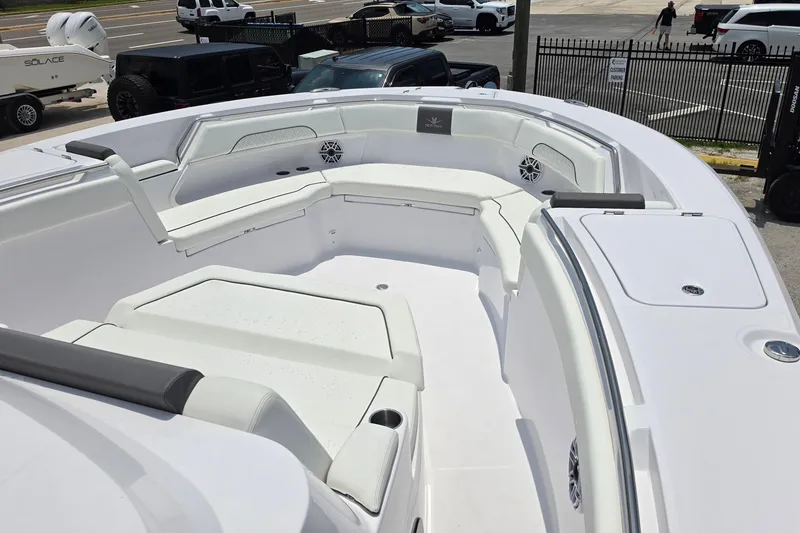 Slide: The Image of 2027 Bertram 39 CC boat with spacious white seating area and modern design. - 17