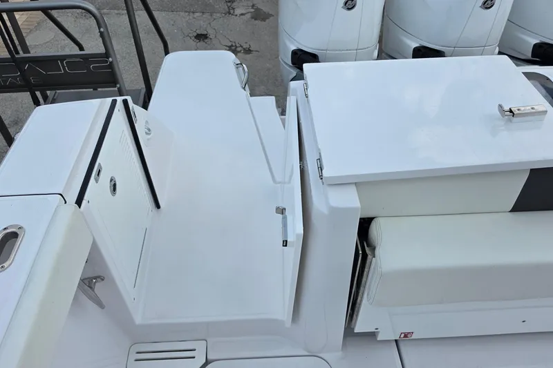 Slide: The Image of Bertram 39 CC 2027 boat deck with storage compartments and seating area. - 32