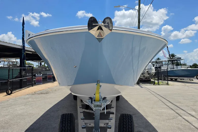 Slide: The Image of 2027 Bertram 39 CC boat on trailer under clear blue sky. - 8