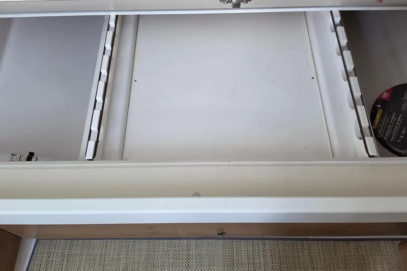 Slide: The Image of Open storage compartment in 2027 Bertram 39 CC boat, showcasing interior design. - 34