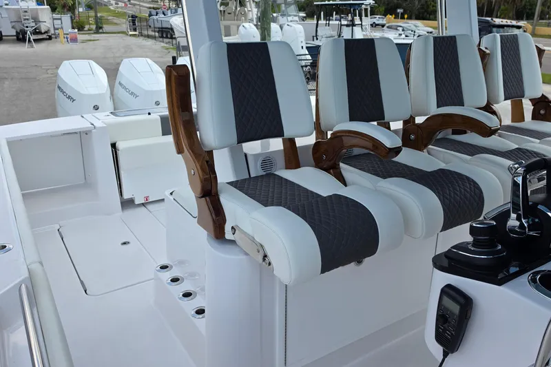 Slide: The Image of 2027 Bertram 39 CC boat interior with luxurious seating and Mercury engines. - 28