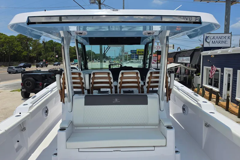 Slide: The Image of 2027 Bertram 39 CC boat interior with seating and helm, docked at Grander Marine. - 12