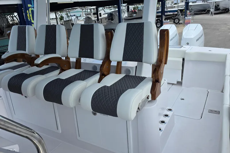 Slide: The Image of 2027 Bertram 39 CC boat with luxurious seating and modern design. - 26