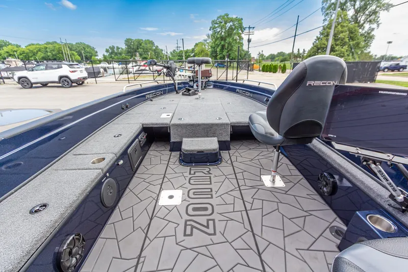 Slide: The Image of 2026 Recon 2085 T boat interior with modern seating and advanced navigation equipment. - 22