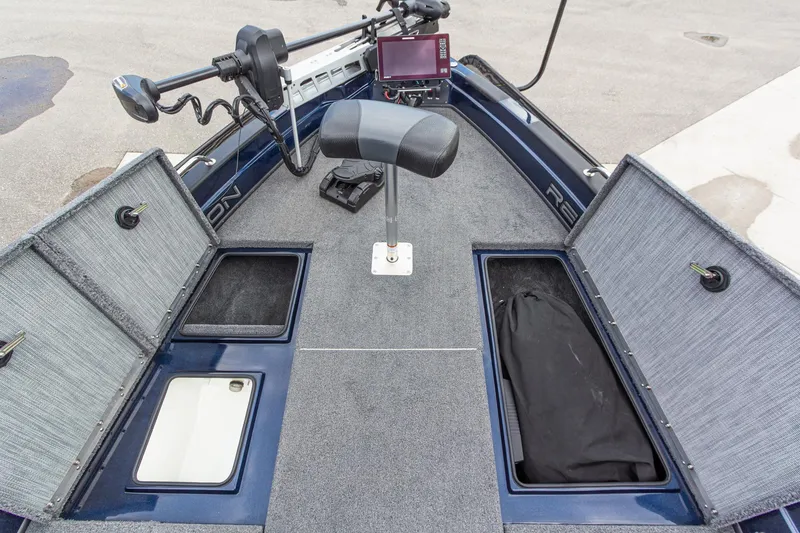 Slide: The Image of 2026 Recon 2085 T boat interior with storage compartments and fishing seat. - 29