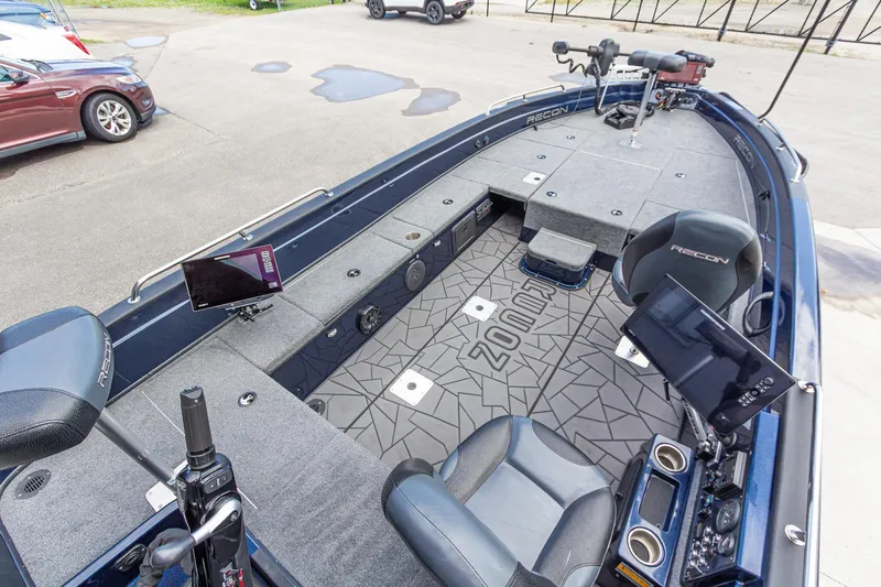 Slide: The Image of 2026 Recon 2085 T fishing boat interior with advanced navigation systems and comfortable seating. - 14
