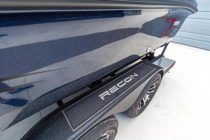 Slide: The Image of 2026 Recon 2085 T boat trailer with sleek design and branded fender. - 12
