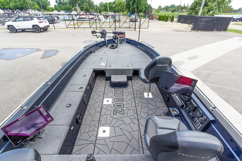 Slide: The Image of 2026 Recon 2085 T boat interior with advanced navigation screens and seating. - 15