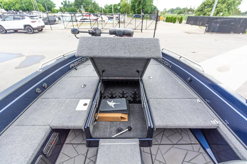 Slide: The Image of Open storage compartment on 2026 Recon 2085 T boat, showcasing interior features and design. - 27