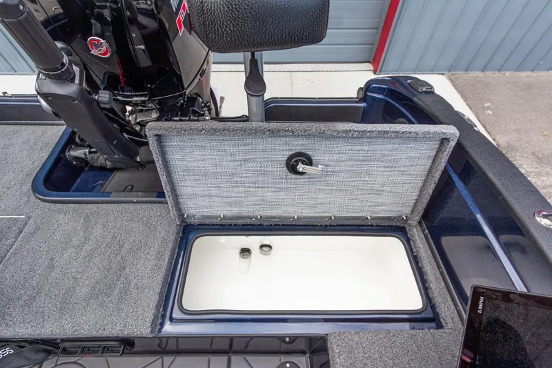 Slide: The Image of Open storage compartment on Recon 2085 T boat, showcasing interior design and functionality, 2026 model. - 21