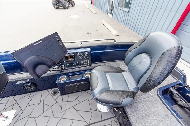 Slide: The Image of Interior of 2026 Recon 2085 T boat with modern controls and seating. - 17