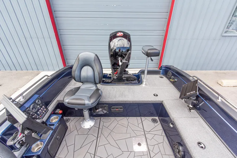 Slide: The Image of Interior of a 2026 Recon 2085 T boat with seating and control panel. - 16