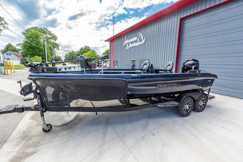 Slide: The Image of 2026 Recon 2085 T boat on trailer outside Lakeside Marina. - 9