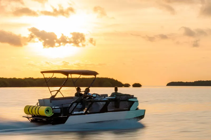 Slide: The Image of 2026 Sea-Doo Switch Cruise 21 on water at sunset, showcasing sleek design and performance. - 7