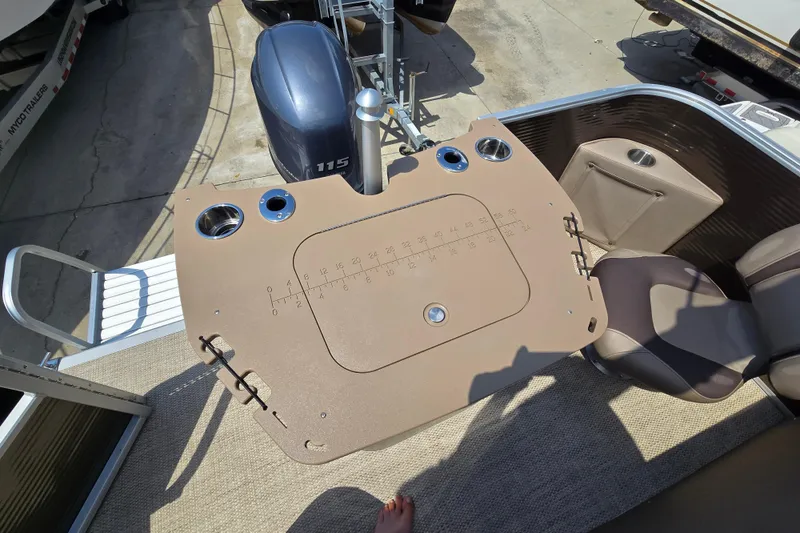 Slide: The Image of 2024 Bennington S22 boat with a fishing station and Yamaha 115 outboard motor. - 21