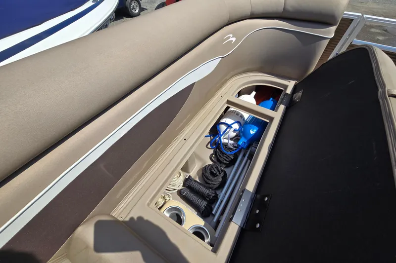 Slide: The Image of 2024 Bennington S22 boat storage compartment with ropes and accessories. - 30