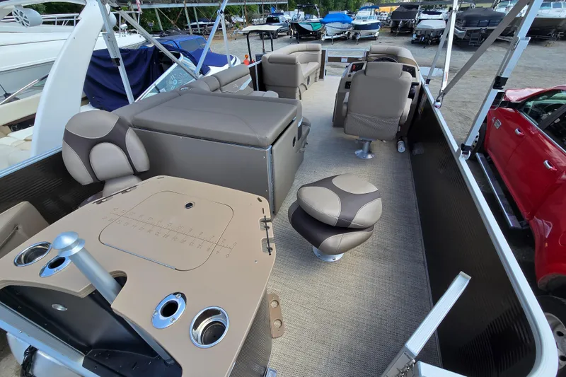 Slide: The Image of 2024 Bennington S22 pontoon boat interior with plush seating and modern amenities. - 15