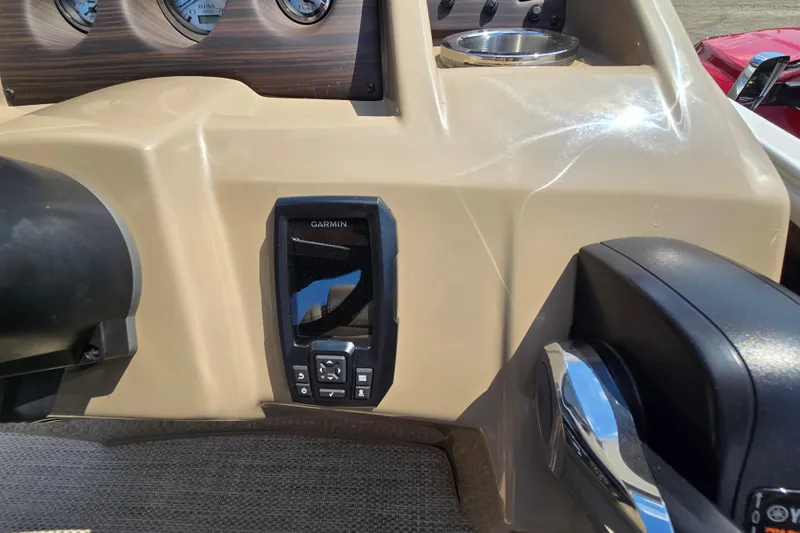 Slide: The Image of 2024 Bennington S22 dashboard featuring Garmin navigation system and control panel. - 27