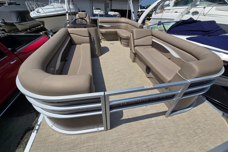 Slide: The Image of 2024 Bennington S22 pontoon boat with spacious seating and modern design. - 17