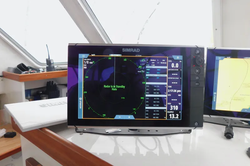 Slide: The Image of Simrad radar display on 1999 Michael Fitz Pilothouse boat, showing navigation data. - 10