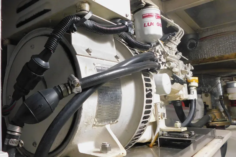 Slide: The Image of Engine room of 1999 Michael Fitz Pilothouse with mechanical components and wiring. - 17