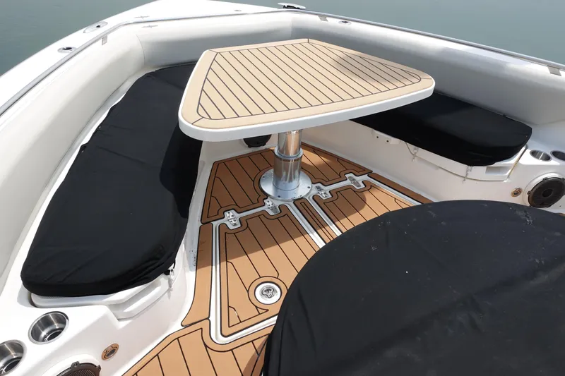 Slide: The Image of 2020 Boston Whaler 420 Outrage boat interior with sleek seating and stylish table design. - 17