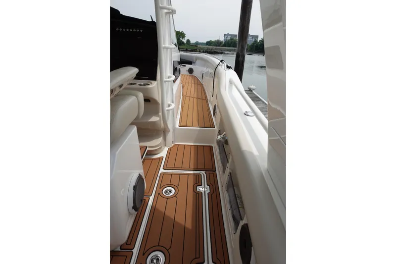 Slide: The Image of 2020 Boston Whaler 420 Outrage boat deck with teak flooring and sleek design. - 15