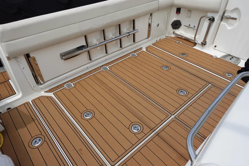 Slide: The Image of 2020 Boston Whaler 420 Outrage deck with teak flooring and stainless steel accents. - 13