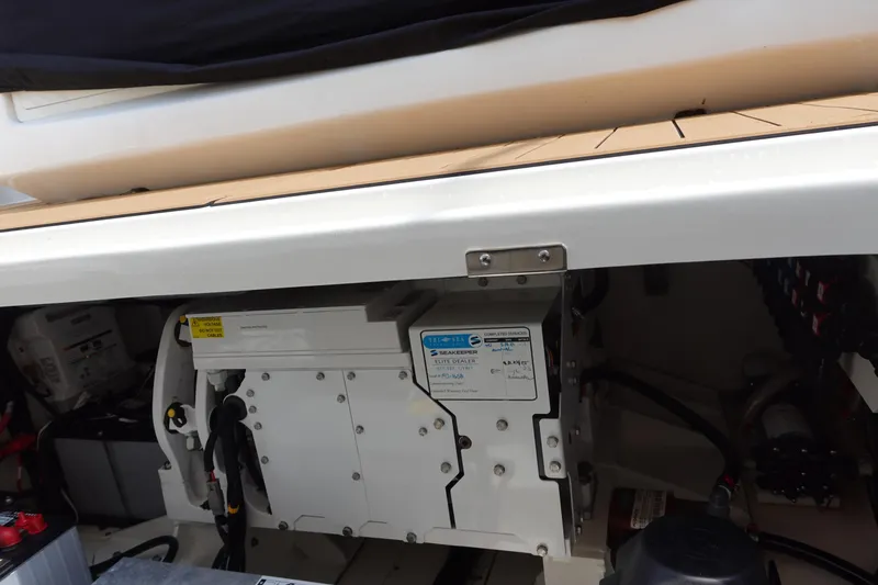 Slide: The Image of Engine compartment of a 2020 Boston Whaler 420 Outrage, showcasing mechanical components. - 24