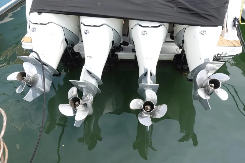Slide: The Image of Four powerful outboard motors on a 2020 Boston Whaler 420 Outrage boat. - 7