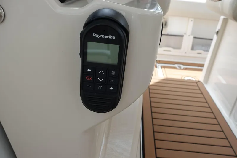 Slide: The Image of Raymarine control panel on 2020 Boston Whaler 420 Outrage boat, with teak flooring. - 26