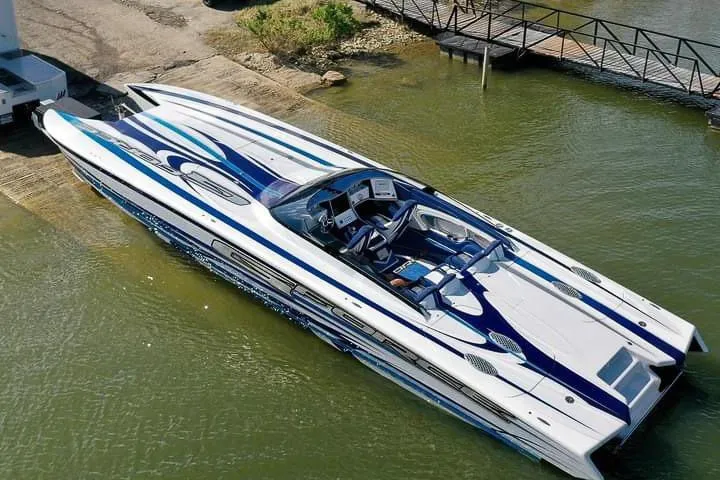 Slide: The Image of High-performance Skater 438 speedboat, 2020 model, docked in calm waters. - 10