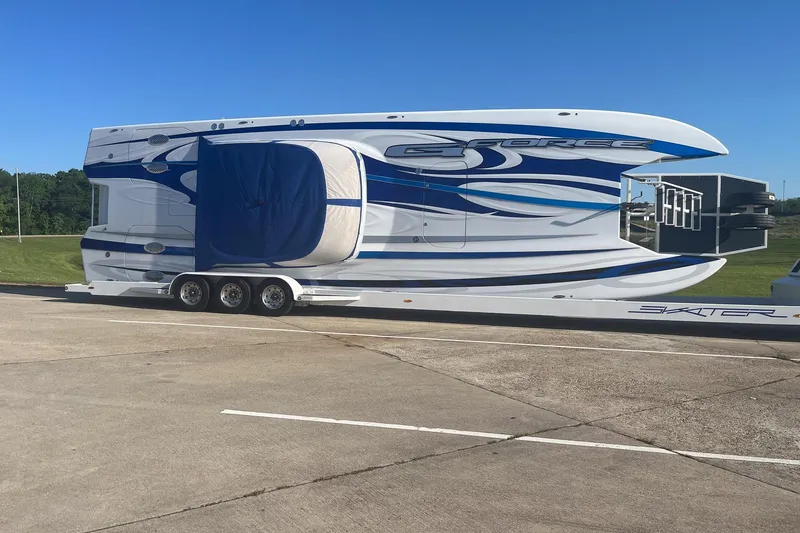 Slide: The Image of Large Skater 438 boat on trailer, 2020 model, parked on concrete under clear blue sky. - 33
