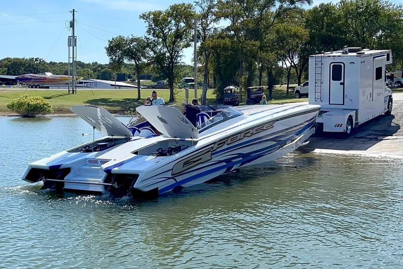 Slide: The Image of High-performance Skater 438 speedboat being launched from a trailer into the water, 2020 model. - 12