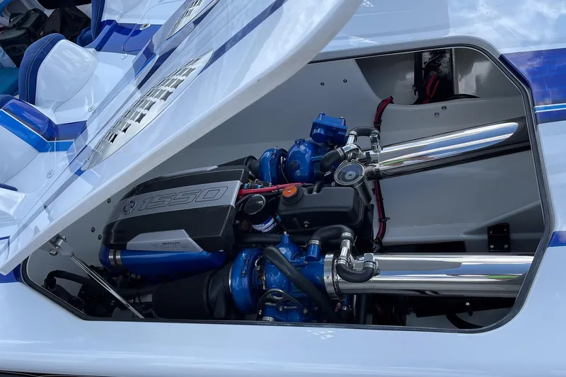Slide: The Image of 2020 Skater 438 boat engine compartment with Mercury 1550 engine, showcasing performance components. - 16