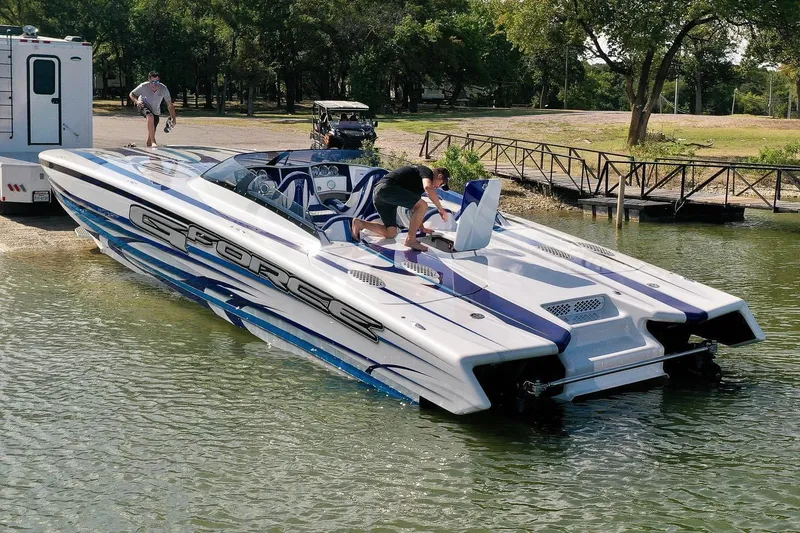 Slide: The Image of High-performance Skater 438 speedboat being launched into a lake, 2020 model. - 11