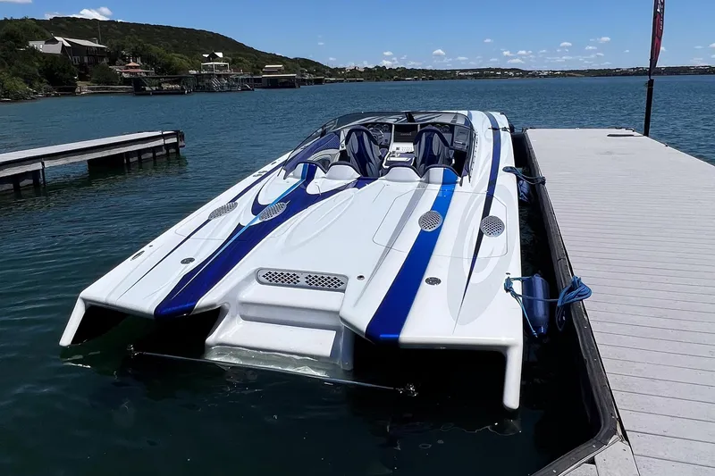Slide: The Image of High-performance 2020 Skater 438 speedboat docked on a serene lake. - 3